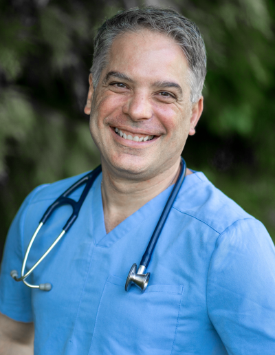 Dr Raul Garcia portrait blue scrubs